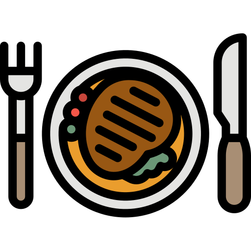 Grilled meat on plate with cutlery.